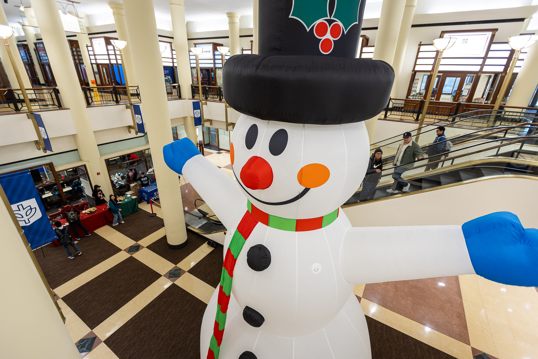 A snowman towered higher than the DePaul Center Concourse was the main attraction for strollers! (Photo by Jeff Carrion / DePaul University) 